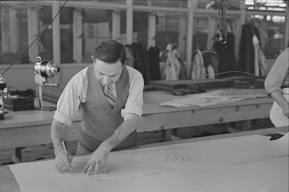 Louis Gushen, chief cutter in the cooperative garment factory at Jersey Homesteads, is cutting the pattern for a woman's coat. Hightstown, New Jersey 1936 russ