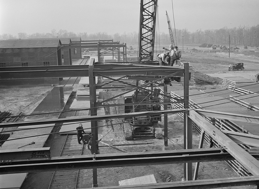 View of metal sheds and slab platforms. These will be used in the manufacture of concrete slabs to be used in the construction of the houses at the Jersey Homesteads.