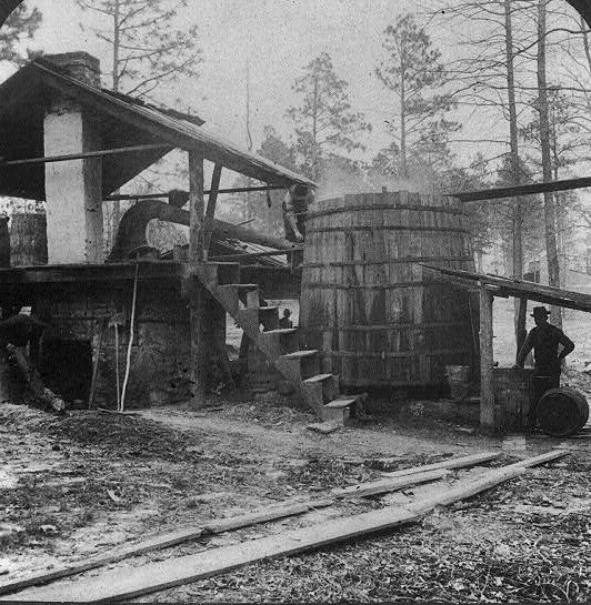 1903 Distilling turpentine from the crude resin in the pine forests of North Carolina