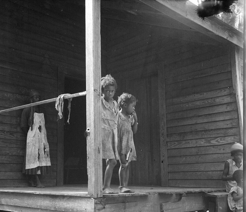 2Children of turpentine worker near Cordele, Alabama. The father earns one dollar a day July 1936 Dorothea Lange