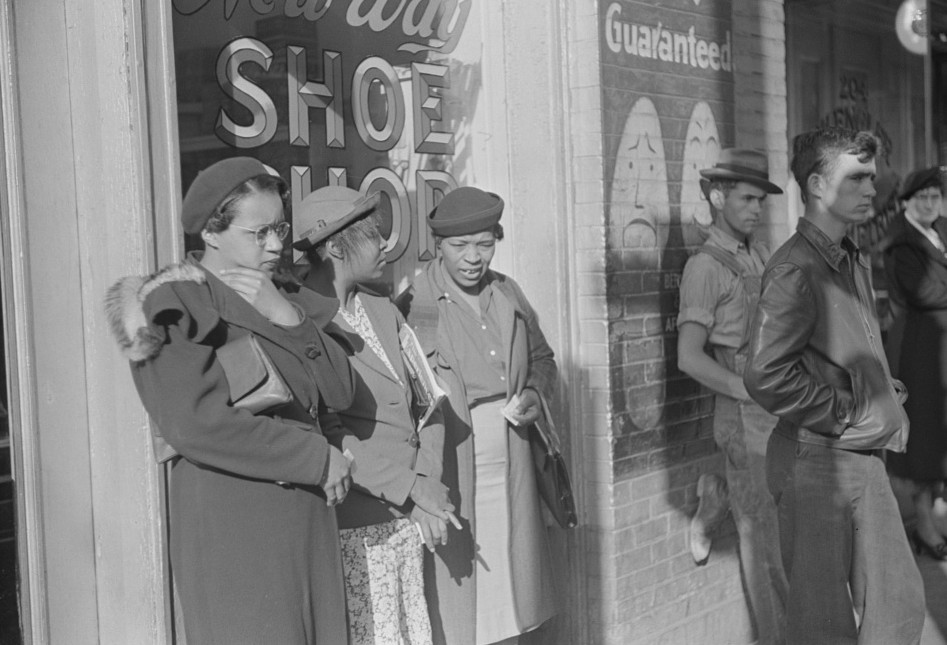 Domestic servants waiting for streetcar on way to work early in the morning. Mitchell Street, 4Atlanta, Georgia