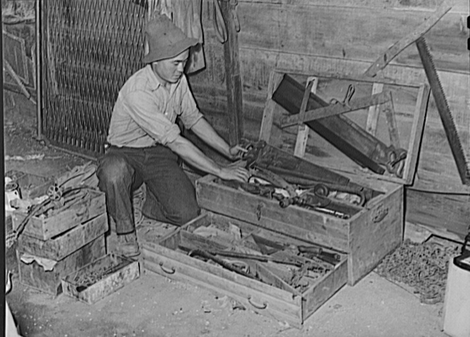 Japanese farmer packing up his tools before he is evacuated from West coast areas under United States Army war emergency order - used