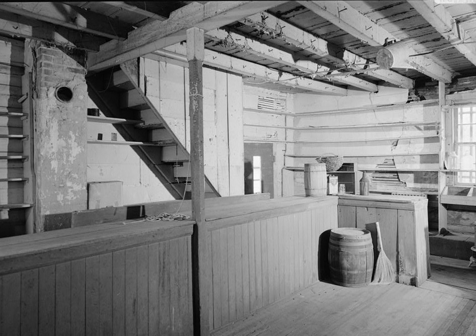 VIEW OF INTERIOR, SOUTH REAR CORNER OF STORE INCLUDING REAR DOORWAY AND PARTIALLY ENCLOSED STAIRWAY TO SECOND FLOOR - Coffren House, Store