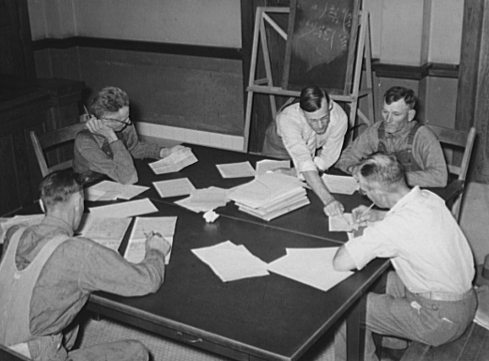 FSA (Farm Security Administration) supervisor explaining plans to clients. Sheridan County, Kansas russell lee 1939