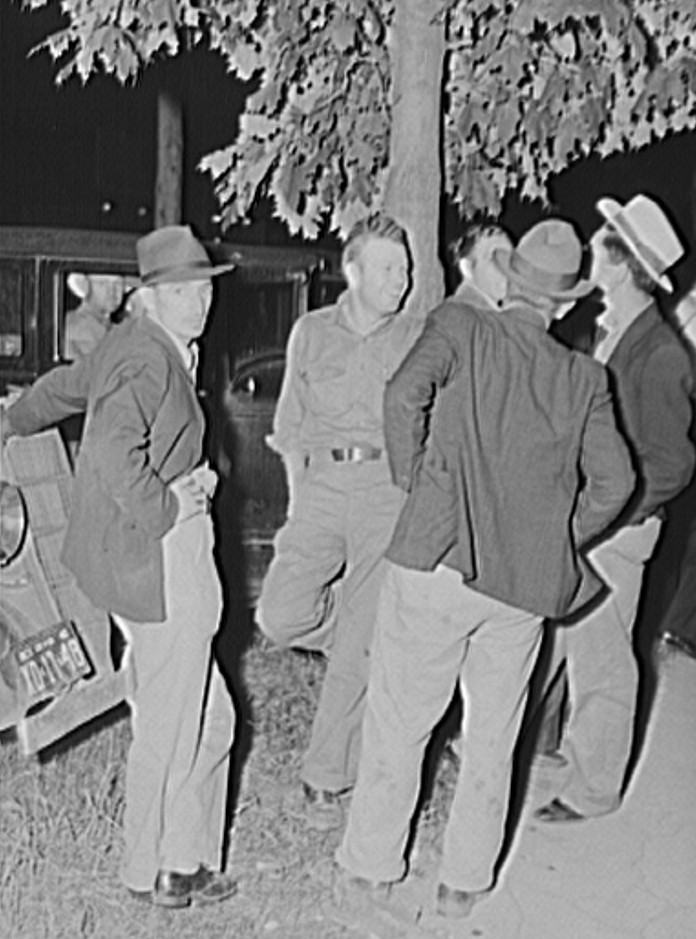 Migrant fruit workers in town on Saturday night. Millburg, Michigan 1940