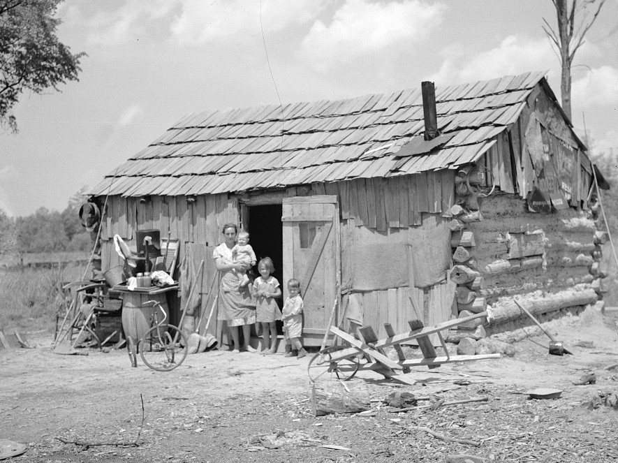 Portion of family of seven in their cabin on United States Highway No. 60 in southeastern Missouri Carl Mydans May 1936