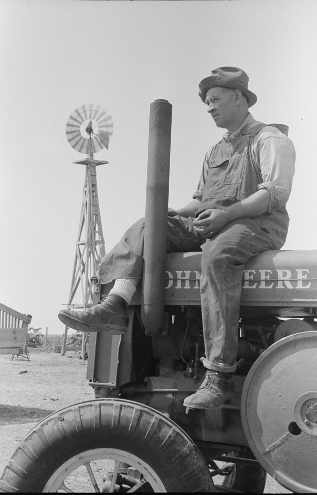 Mr. Germeroth, Farm Security Administration client sitting on tractor which was bought by means of FSA loan, Sheridan County, Kansas russell lee2 1939