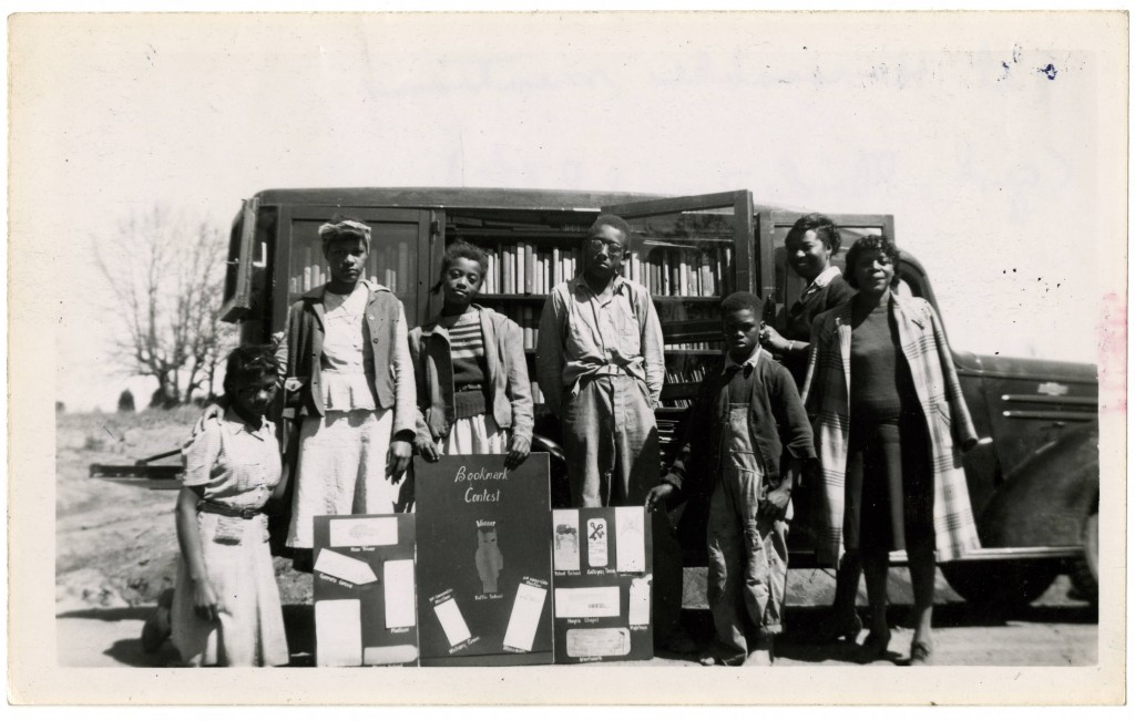 Bookmark_contest_winner_first_honorable_mention_and_others_pose_in_front_of_bookmobile
